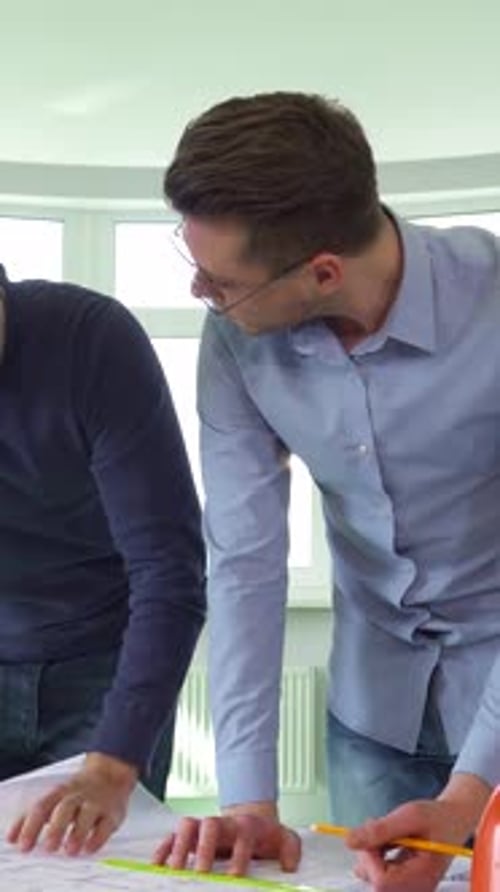 Dynamic Collaboration Between Architects in a Sleek Modern Office