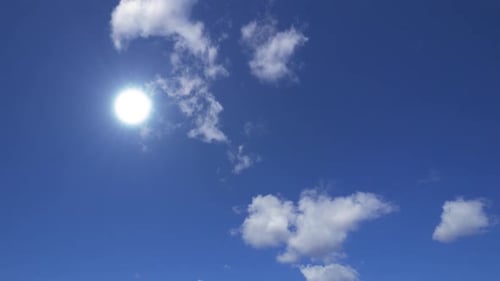 Clouds Floating Across Blue Sky on a Sunny Day