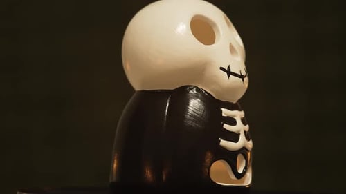 Skeleton Candle Holder Rotating in the Dark