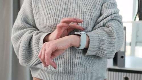 Woman Using Smartwatch Technology on Her Wrist