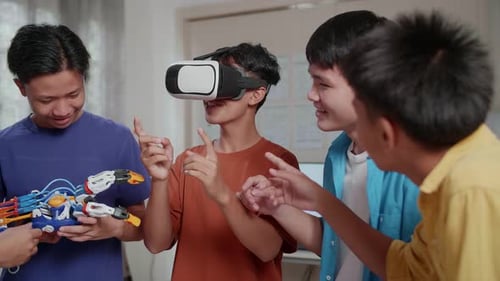 A Boy Enjoy Working On Metaverse While His Friends Discussing About A Cyborg Hand
