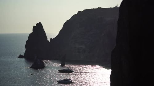 Sea Landscape with Yachts and Rocky Coastline Yachts in the Sea on a Background of Rocky Shores The