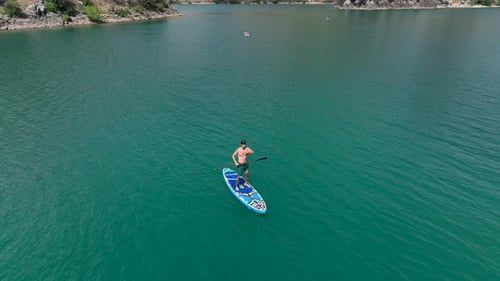 Aerial View Scenic Paddleboard Adventure Through the Green Canyon People Swimming and Enjoying