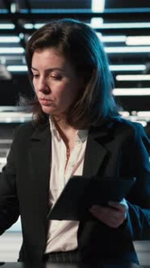 Vertical Video Data Center Female Admin Uses Device and AR Simulation to Conduct Security Audit