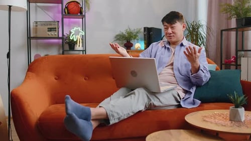 Man Chatting on Laptop From Home