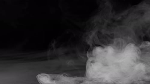 Abstract White Smoke Drifts on Black Background