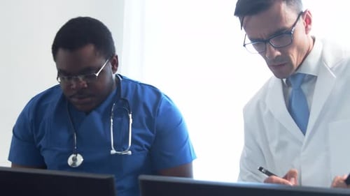 Doctor and Surgeon Talking Near Window Medical Workers in Hospital Office Day Light Healthcare