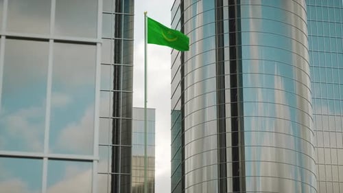 Mauritania Flag Waving on Modern Corporate Building