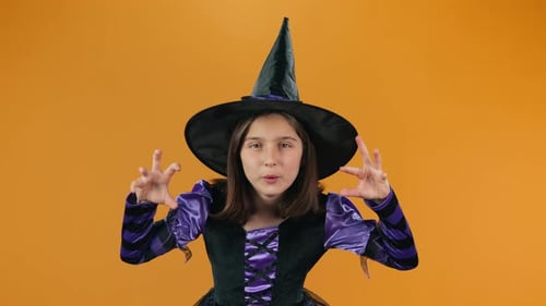 Teen Girl in Witch Costume Casting Spell