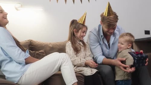 Little Boy Surprises Family with Birthday Gift at Home Party Celebration