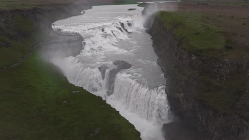 Aerial View of Gullfoss Waterfall Cascading Into a Rugged Canyon