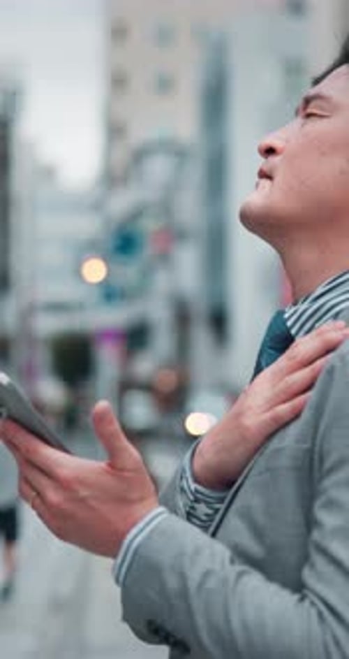 Man, business or pain in city with phone, emergency contact or burnout in Tokyo