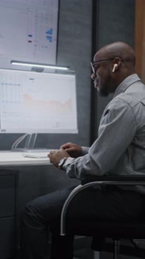 Stock Exchange Trader in Wireless Headphones Having Call Monitoring RealTime Stocks