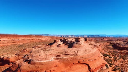 Flying away form the beautiful sandstone rocks located in the vast desert.