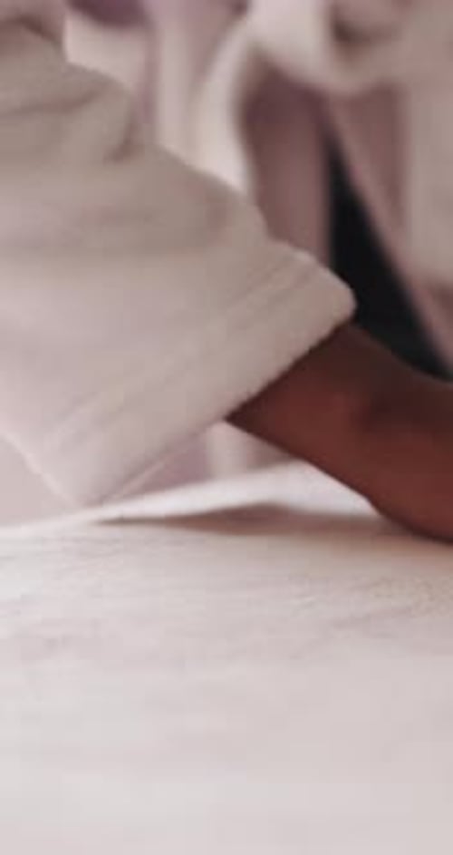 Hand, bedroom and woman with blanket, cleaning and chore with mattress, comfort and calm