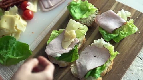 Making Tasty Open Sandwiches with Ham and Cheese