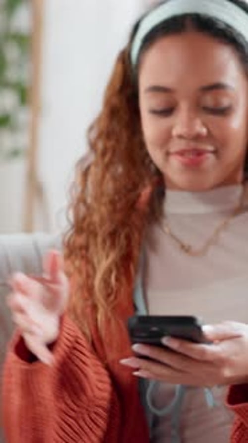 Smiling Young Woman Uses Phone