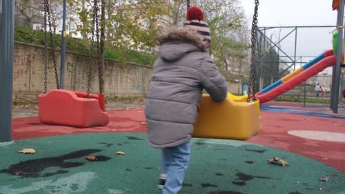 Child Playing on Playground
