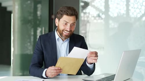 Man Excited About Letter Received at the Office
