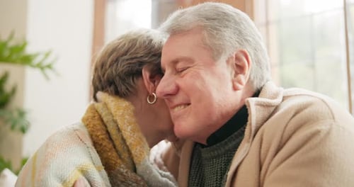 Affectionate Senior Couple Embracing at Home