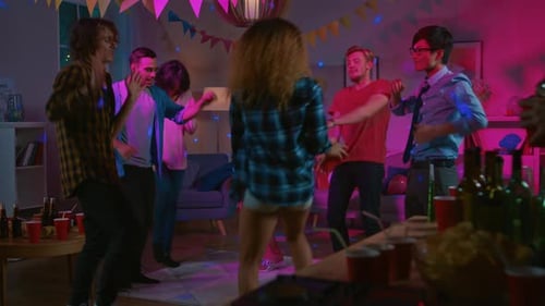 At the College House Party: Diverse Group of Friends Have Fun, Dancing and Socializing. Boys and Gi