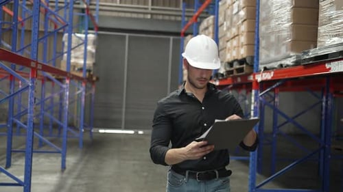Blue collar workers working at warehouse.