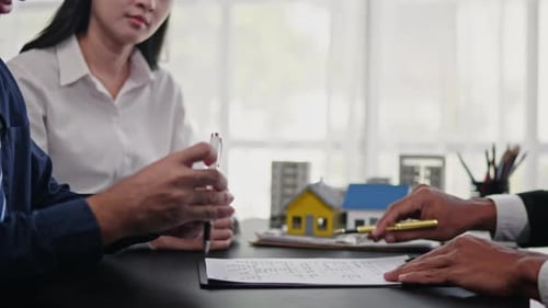 Business Meeting: Signing, Handshake, and Agreement