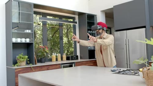 Man Wearing VR Headset in Modern Kitchen