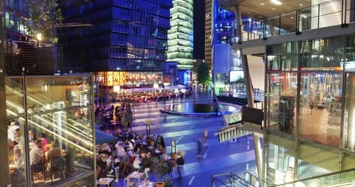 Berlin/Germany - 15.09.2018: Timelapse of a large city in the evening where there are glass skyscr