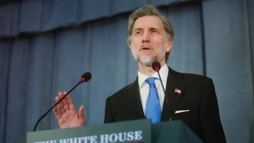 Confident Man Giving Speech at White House Podium