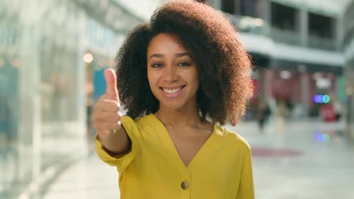 Happy Woman Giving Thumbs Up Gesture