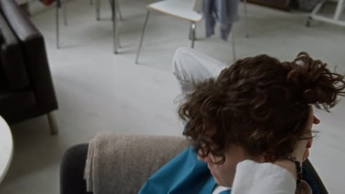 Healthcare Worker Relaxing After Work in Living Room