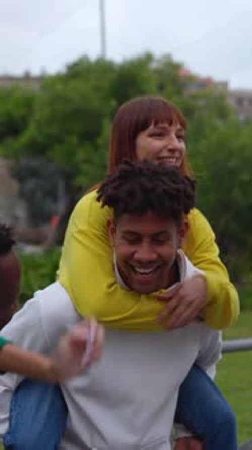 Friends Enjoy Piggyback Ride in the City