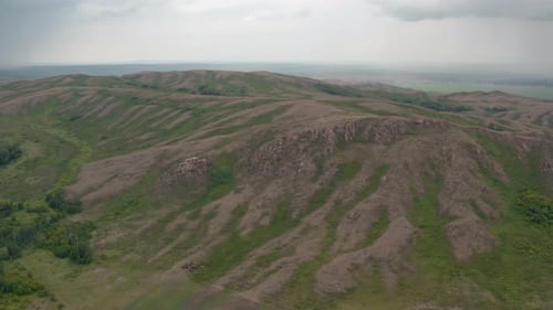 Aerial View of Green Rolling Hills Landscape