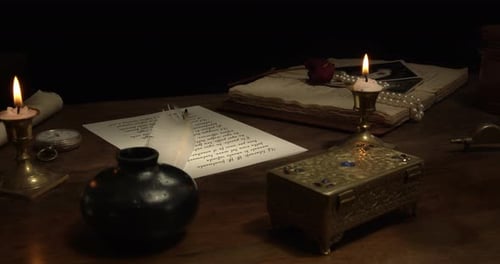 Old Fashioned Writing Desk with Candles and Letter