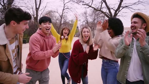 Large Group of Happy Young Friends Having Fun and Celebrating in the Park