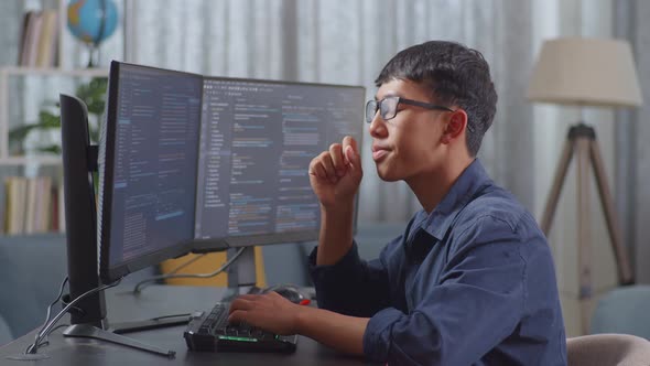 Asian Boy Programmer Yawning And Sleeping While Creating Innovative ...