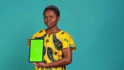 Gorgeous Model Presenting a Tablet with Green Screen Mockup