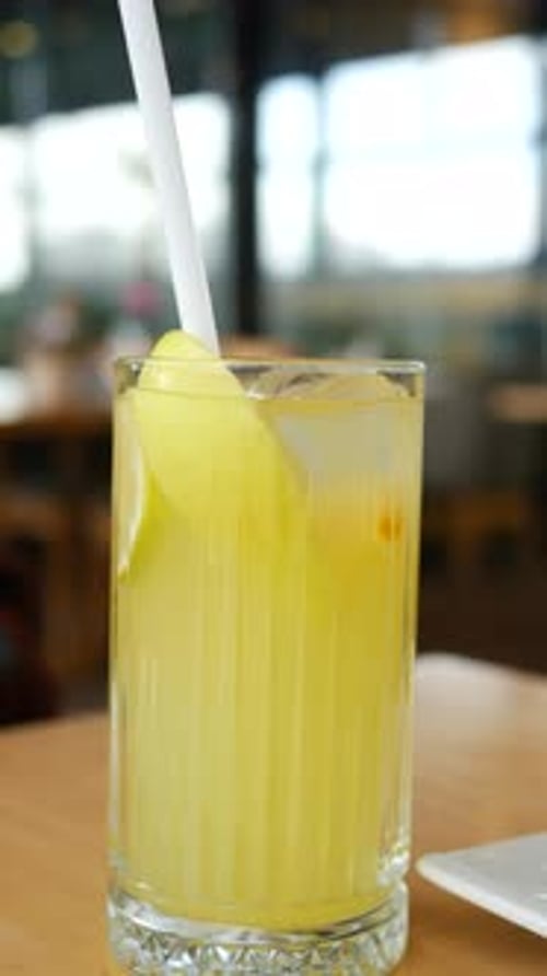 Glass of Orange Juice on Cafe Table