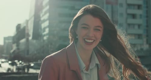 Smiling Young Woman Posing in the City