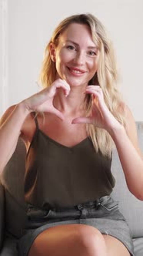 Woman Makes Heart Shape With Her Hands