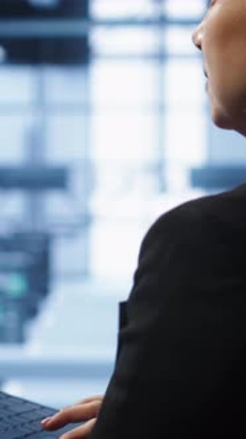 Vertical Video Technician Doing Checkup Inputting Data on Laptop of Needed Server Hub Fixes