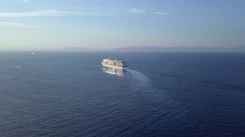 Mega Cruise ship sailing across The Mediterranean sea - Aerial footage