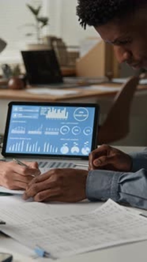 Business professionals reviewing financial data in office setting