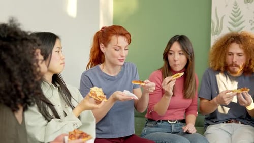 Friends Enjoying Pizza Together at Home