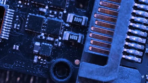 Computer motherboard components. Microchips top view in blue light, CPU processor.