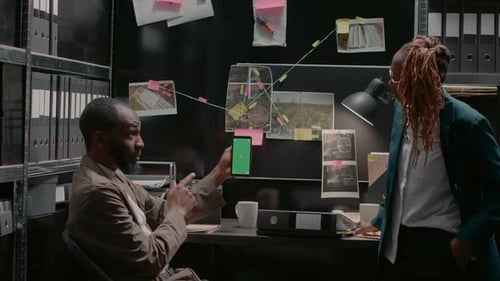 Police Partners Analyzing Smartphone with Greenscreen