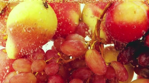 Background with fruits and berries in water with air bubbles.