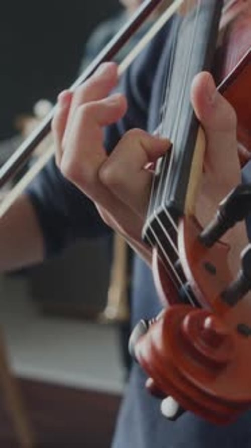 Boy Plays Violin in Music Room