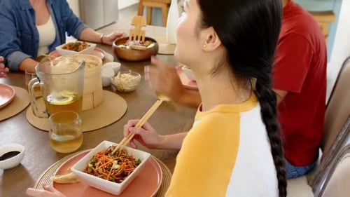 People Enjoying a Meal Together at Home